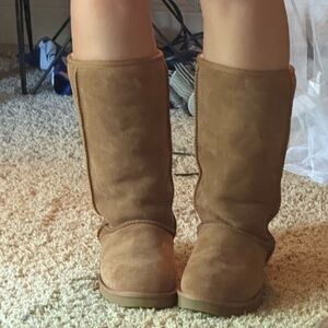 woman’s chestnut knee high UGGs